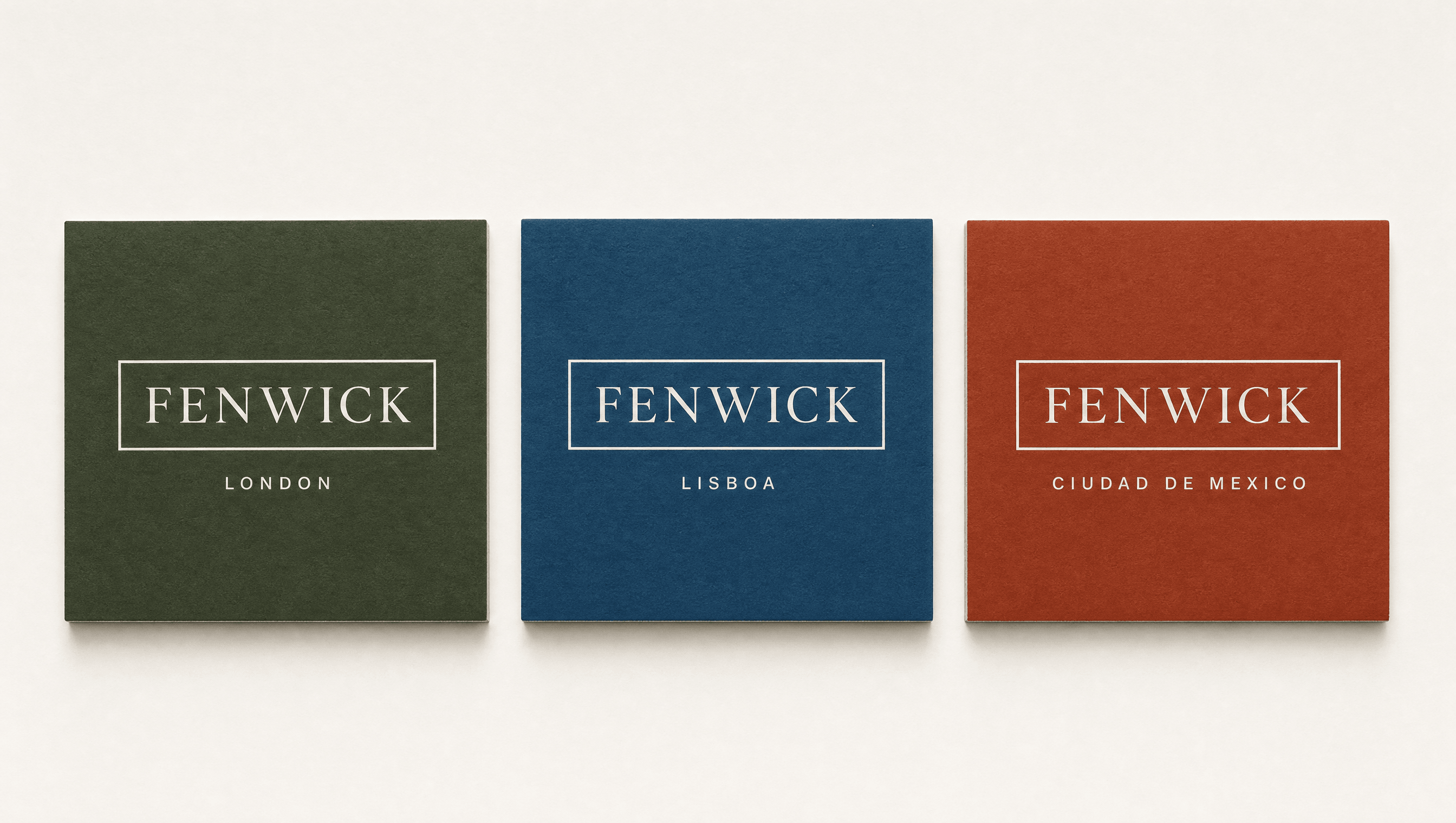 Three Fenwick membership cards in three city colours